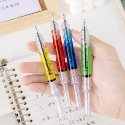 China Creative Syringe Style Ballpoint Pen Colorful Oil Filling Plastic Ball Pen for sale