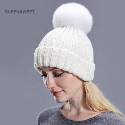 China breathable & Fashion Women Girls Waterproof Fluffy Fur Real Pom Pom Acrylic Hat Logo Winter Warm Beanie Hat Custom Knit Hat for sale