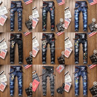 China Men's breathable jeans with slim-fitting, ripped feet are the summer trend for 2022 for sale