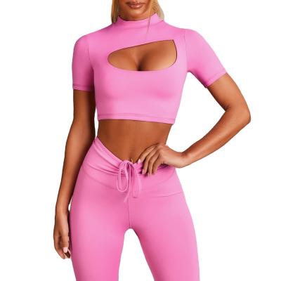 China Breathable Women Cross Yoga Suit Empty Back Sports Shaping Vest And Seamless Shorts Women Yoga Suit for sale