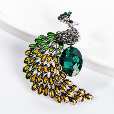 China Sparkling Rhinestone Peacock Brooches Delicate Emerald Crystal Animal Bird Brooch Pins Fashion Accessories Great For Women for sale