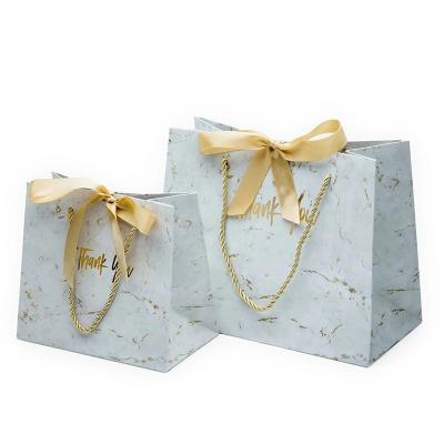 China Custom Luxury Recycled Materials Fashion Design Printed Marble Effect Recycled Paper Logo Bag With Ribbon Bow Knot for sale