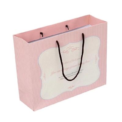 China Recycled Materials Pad Custom Design Luxury Golden Stamping Printing Reusable Kraft Paper Bag for sale