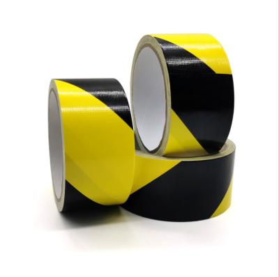 China Free Sample Heavy Strong Fabric Adhesive Rubber Adhesive Tape Waterproof,Easy Tear Fabric Yellow Black Warning Adhesive Tape for sale