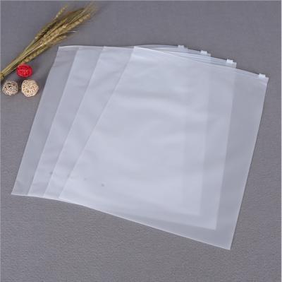 China Custom Recyclable Logo Matte Ziplock Clothing Zipper Poly Packaging Plastic Transparent PE Slider Zipper Lock Zipper Frosted Garment Bags for sale