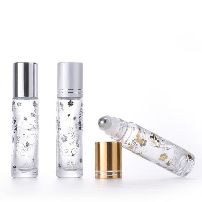 China Cosmetic 10ml Gold Sliver Cap Clear Roll On Bottle Glass Roller Bottle With Stainless Glass Ball Ball For Essential Oils for sale