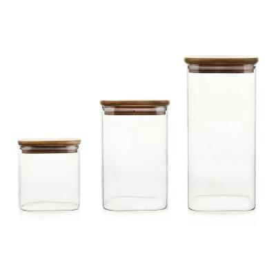 China Steamable High Borosilicate 4oz 8oz 500ml Storage Food Cookie Stash Glass Jars With Bamboo Lid for sale