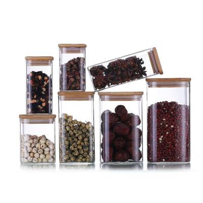 China Food Canisters Food Serving Borosilicate Clear Square Candy Glass Jar With Airtight Bamboo Wooden Lids for sale