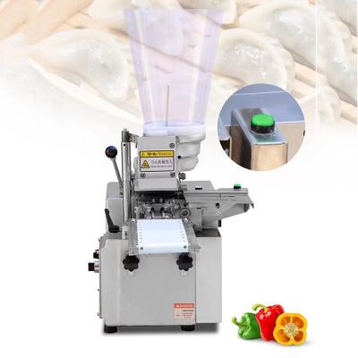 China Momo 110V 60hz table top gyoza machine for sale, china supplier for fried dumplings machine for stalls Saudi Arabia for sale