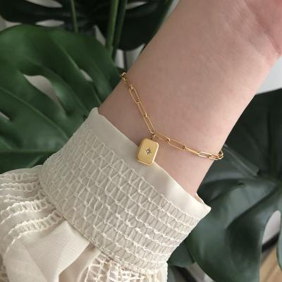 China Simple Design Trendy Tasty Trendy Stainless Steel Paper Clip Chain Bracelet 18k Gold Plated CZ Stone North Star Square Pendant Bracelet for sale