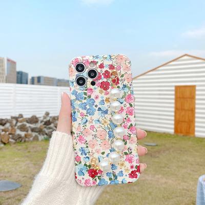 China 2021 New Arrival TPU Flower Phone Cases With White Beads Bracelet Mobile Phone Bags And Cases For Girls for sale