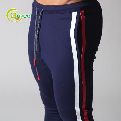 China QUICK DRY Custom Ankle Zipper Track Pants Men's Sport Joggers Drawstring Side Stripe Cotton Gym Pants Workout Joggers for sale