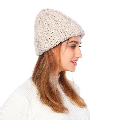 China COMMON JOINT Chunky Winter Elegant Women's Soft All-match Covers Warm Oversized Solid Knitted Wool Beanie Trendy Simple Women's Cable Hat for sale