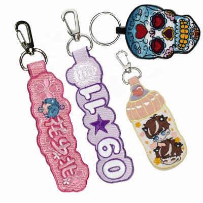 China Embroidery Key Chain Newly Designed Cartoon Embroidery Manufacturer Supply Logo Custom Strap Key Chain Key Chain With Embroidery Key Chain Wholesale for sale