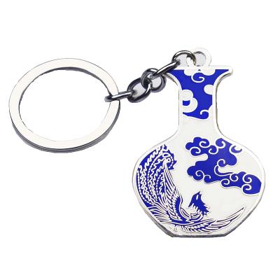 China Promotional gifts full of Chinese taste folk art enamel pin metal blue and white porcelain custom key chain for sale