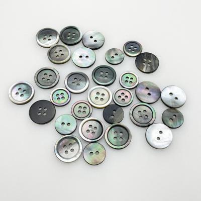 China Custom Made Pearlescent Natural Black Round Shell Button For Shirt Clothing Durable 2 Holes for sale