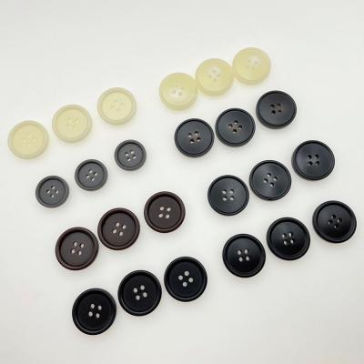 China Viable factory selling round bread shape sewing plastic button, 4 holes horn resin polyester button for overcoat and suits for sale