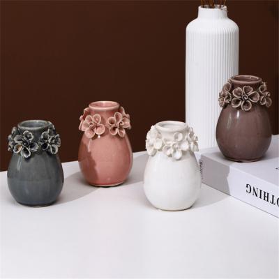 China Nordic style ceramic vases modern unique table top emboss flower decor ceramic luxury small flower vase for sale