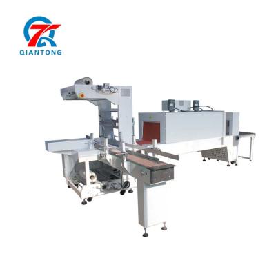 China Miscellaneous Factory Promotional Goods Using Shrink Wrapping Machine Auto-shrinking Packing Machine for sale