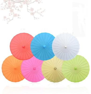 China Traditional Chinese Style Children Size Parasol 23.6inch 60cm Wedding Handle Art Craft Umbrella Blank Paper Small Chinese Along for sale