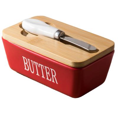 China Freshness Preservation Good Quality 350ML red Butter Dish Storage Box Ceramic Butter Dish Box With Knife and bamboo lid for sale