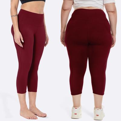 China Breathable custom logo printed pure high yoga color mature women multi size saxi girl waist yoga capris leggings tops with pockets for sale