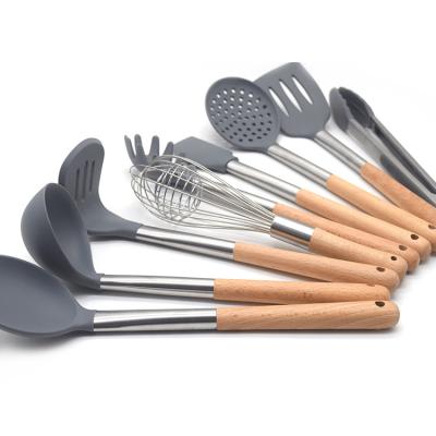 China 9pcs Kitchen Silicone Stocked Accessories Sets Nonstick Spatula Tong Whisk Spoon Utensils Silicone Set with Wooden Handle for sale