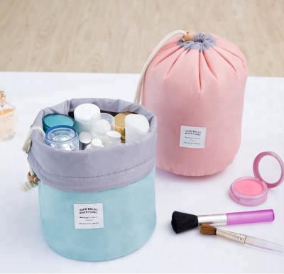 China Custom Made PVC Waterproof Drawstring Fashion Topsale Beauty Bag Travel Cylinder Makeup Bag Cosmetic Organizer for sale