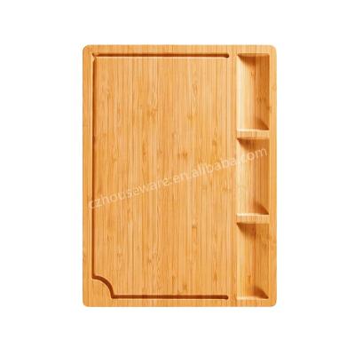 China Sustainable premium quality bamboo board with side handles drip separate groove and 3 compartment bamboo cutting board for sale