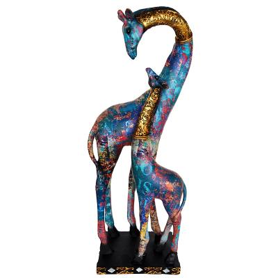 China Unique Europe Design Giraffe Resin Sculpture For Home Decor Lovely Giraffe Baby Statues In Decor Graffiti Hand Painted Craft for sale