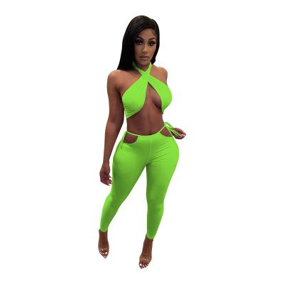 China Breathable Women Tops Club Wear Halter Crop Tops Tight Two Piece Hollow Out Pants Set for sale