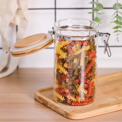 China 2021 Sustainable Products China Wholesale Glass Salt Jar Salt Tending Wooden Lids for sale