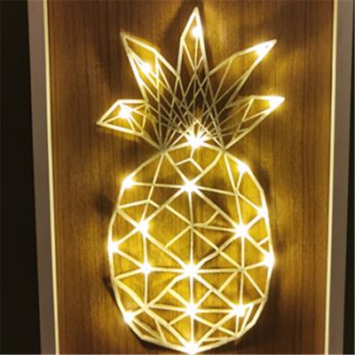 China Pineapple Nonwoven Textiles With Wooden Pineapple Frame Light Decoration Led Lights for sale