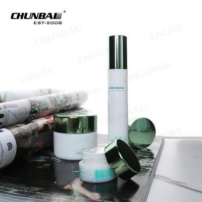 China 2022 New Empty Frosted White Ceramic Containers Glass Bottles 100ml With Pump Cosmetics Packaging Set for sale