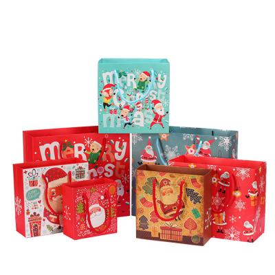 China Recycled Materials Wholesale Cute Red Party Gift Bags Custom Printing Cartoon Paper Bulk Package Merry Christmas for sale