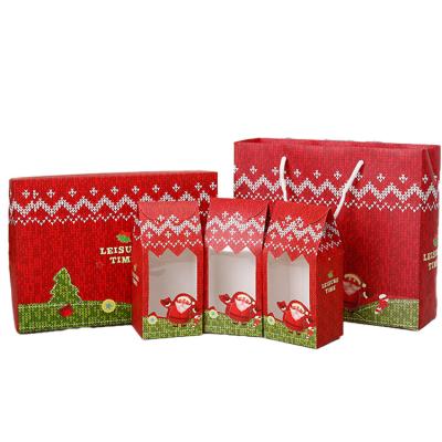 China Recycled Materials Wholesale Red Christmas Packaging Bags Present Kraft Paper Bag With Clear Window For Gift Package for sale