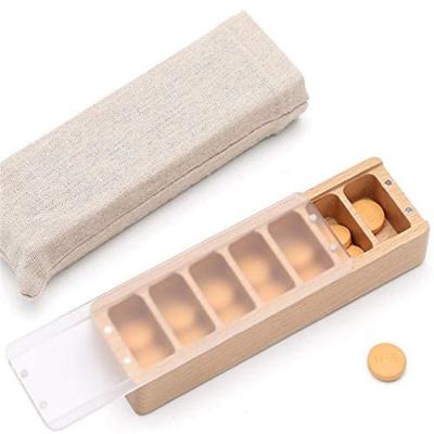 China Sustainable Wooden Rectangle Pill Box 7 Compartments Moisture Resistant Storage Container For Home Or Travel for sale