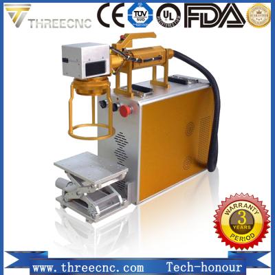 China Raycus laser source metal and nonmetal process Fiber laser markingmachine with the best quality. TL20W THREECNC for sale