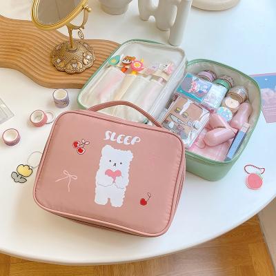 China NATIONAL Hot Seller Amazon Pattern Large Capacity Cute Cosmetic Travel Bag Customized Cartoon Makeup Waterproof Bag With Handle for sale