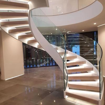 China 2022 Modern Smartart Curved Staircase with Glass Balustrade and American Oak Treads Arch Indoor Wood Stairs for sale