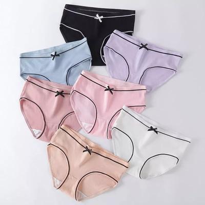 China Solid Color Breathable Cheap Ribbed Underwear XuanLing Sexy Cute Bow Briefs Girl's Mid Waist Breathable Seamless Panties for sale