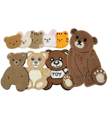 China Viable Factory Wholesale Brown Bear Decoration Cute Laser-Cut Patch Laser-Cut Border Iron On Backing Embroidery Patches for sale