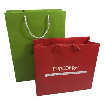 China Wholesale custom luxury brand disposable premium boutique printing factory paper shopping bags with your own logo for sale