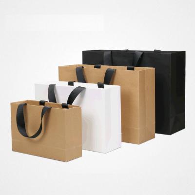 China Custom Logo Shopping Paper Bag China Packaging Suppliers Recyclable Paper Bag Packaging Shop Bags With Handle for sale