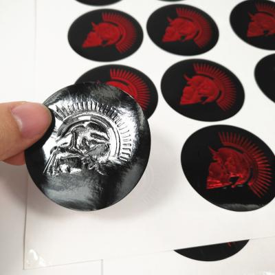 China Custom Logo Sticker Vinyl Paper Foil Emboss Printing Logo Product Bottle Label Sticker for sale