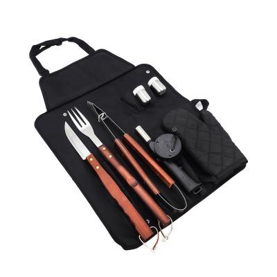 China Easily Cleaned BBQ Grill Accessories Tool Kit Wood Handle Grilling Tools with Apron Tongs Knife Fork for sale