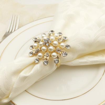 China Factory Wholesale Metal Sliver Pearl Flower Viable Napkin Holder White Snowflake Napkin Rings for sale