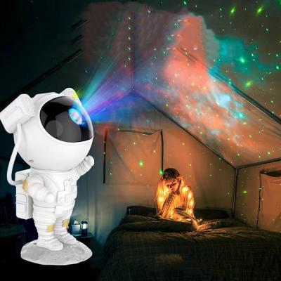 China New-designed 2022 Multicolor Rotating Near Table Night Lamp Surf Astronaut Starry Sky Projector Light for sale