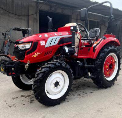 China 70HP 704 Tractor de cuatro ruedas con tracción en ruedas con motor diésel, segundo y tercer modelo nacional de tractor de ruedas con arado en venta