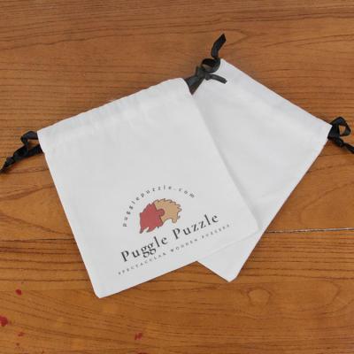 China Recyclable Custom Puggle Puzzle White Canvas Drawstring Bag Cotton Strip Mouth Absinthe Sachet Storage Bag for sale